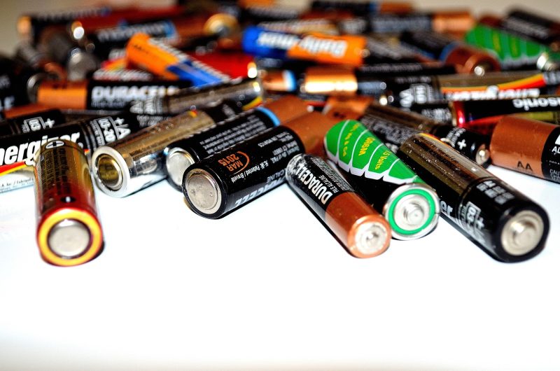 A collection of batteries on a white background