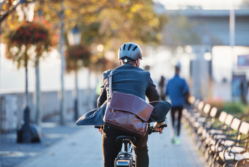man commuting on bike